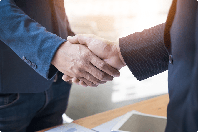 Two business men greeting one another